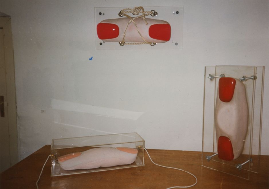 Photo shows three double-fingered objects by Lambert Maria Wintersberger. Large fingers with painted fingernails at both ends.