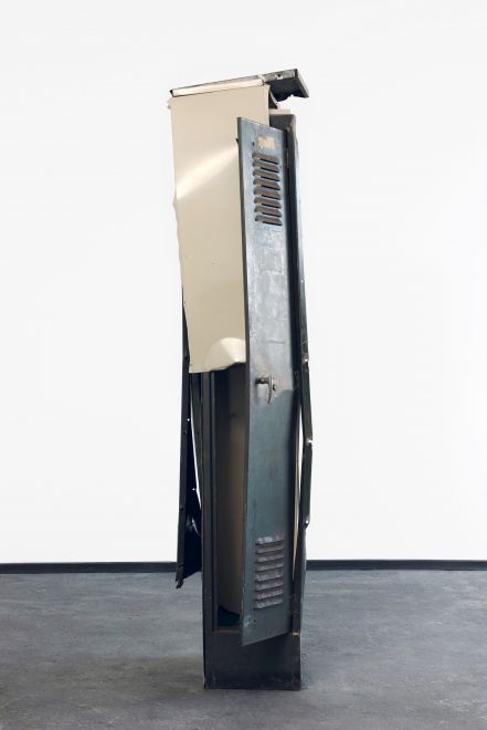 Edition by Olaf Metzel. Beige and olive green metal locker, destroyed and reassembled with an angle grinder. The object is reminiscent of cubist compositions