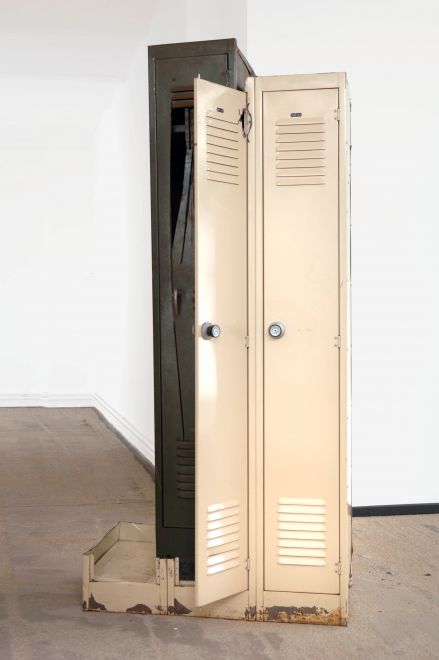 Edition by Olaf Metzel. Beige and olive green metal locker, destroyed and reassembled with an angle grinder. The object is reminiscent of cubist compositions