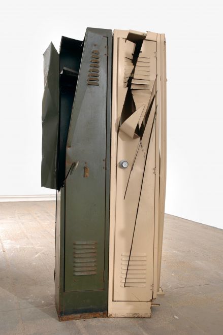 Edition by Olaf Metzel. Beige and olive green metal locker, destroyed and reassembled with an angle grinder. The object is reminiscent of cubist compositions