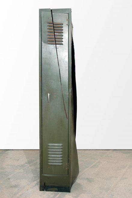 Edition by Olaf Metzel. Olive green metal locker, destroyed with an angle grinder. The object is reminiscent of cubist compositions