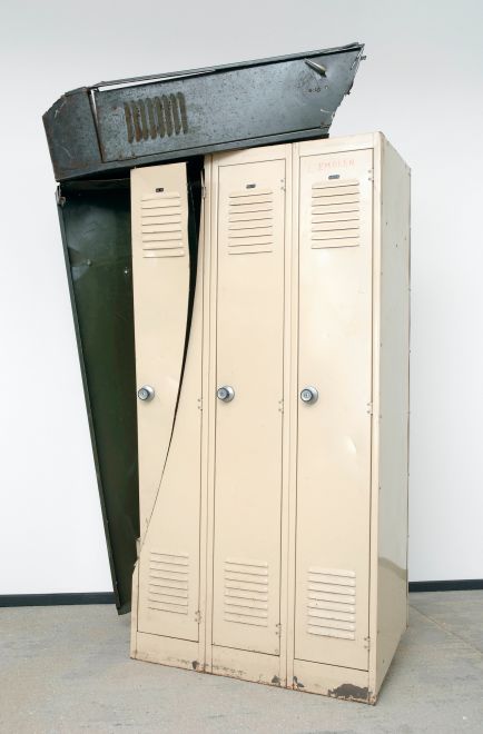 Edition by Olaf Metzel. Beige and olive green metal locker, destroyed and reassembled with an angle grinder. The object is reminiscent of cubist compositions