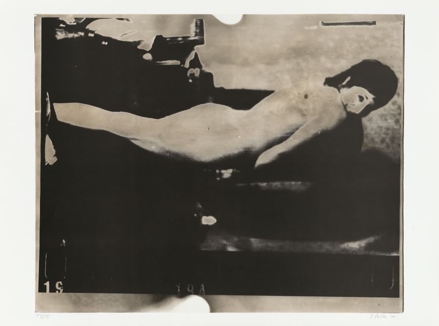 Offset print by Sigmar Polke. Blurred and heavily reworked photographic film shows a naked woman. She is standing turned away in Polke's studio.
